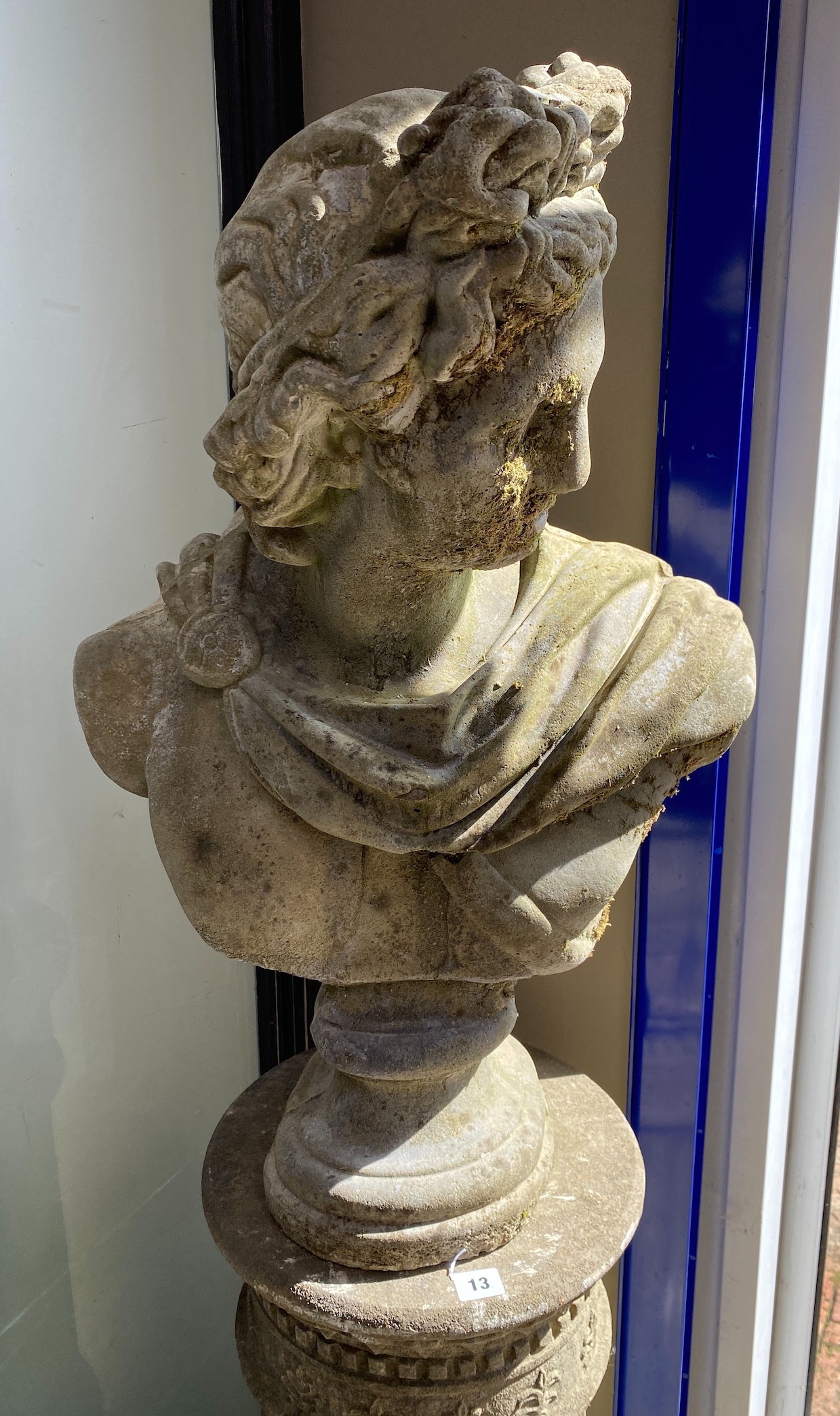 A reconstituted stone Roman style bust on circular fluted pillar, height 164cm
